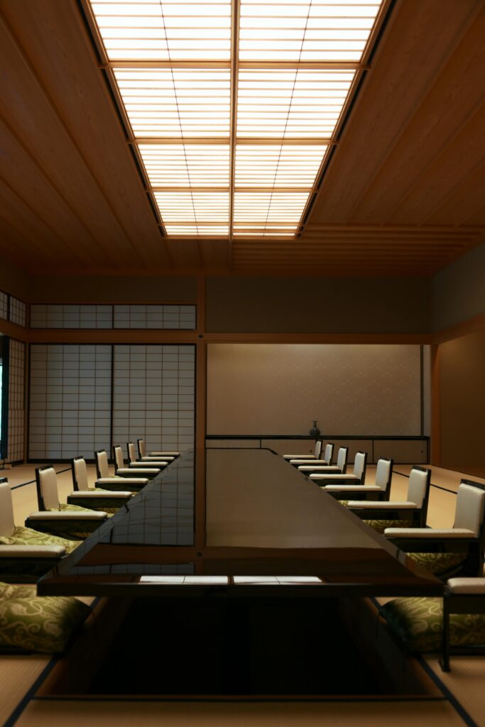 Beautifully designed traditional Japanese meeting room featuring wooden elements and tatami mats.
